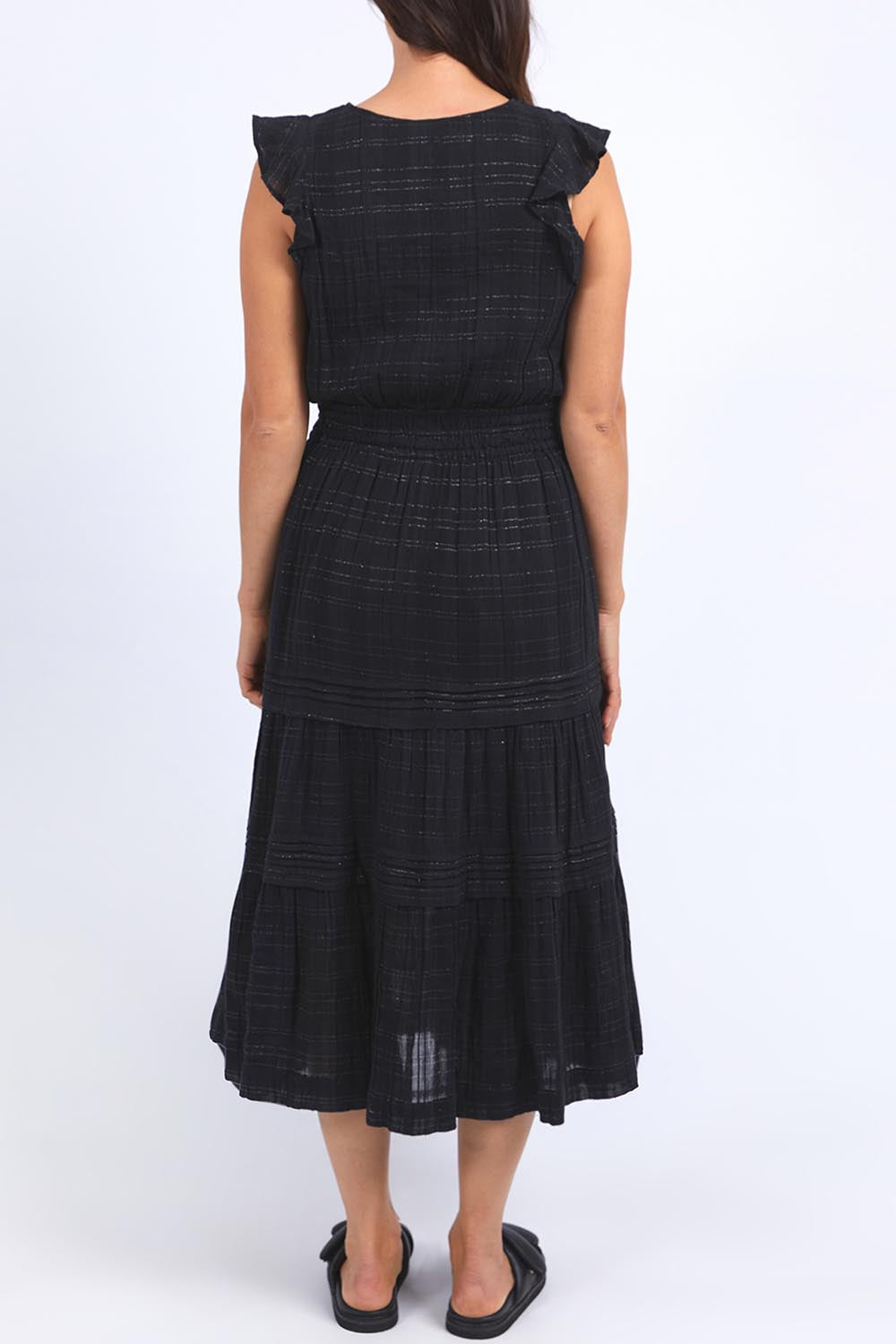 A model wearing the Isabella Cotton Blend Dress in colour Black (Black), from the back