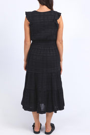 A model wearing the Isabella Cotton Blend Dress in colour Black (Black), from the back