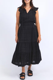 A model wearing the Isabella Cotton Blend Dress in colour Black (Black), from the front, cropped image