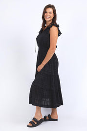 A model wearing the Isabella Cotton Blend Dress in colour Black (Black), from the front, showing the whole outfit