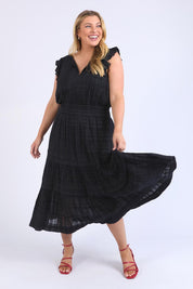 A model wearing the Isabella Cotton Blend Dress in colour Black (Black), from the front, showing the whole outfit