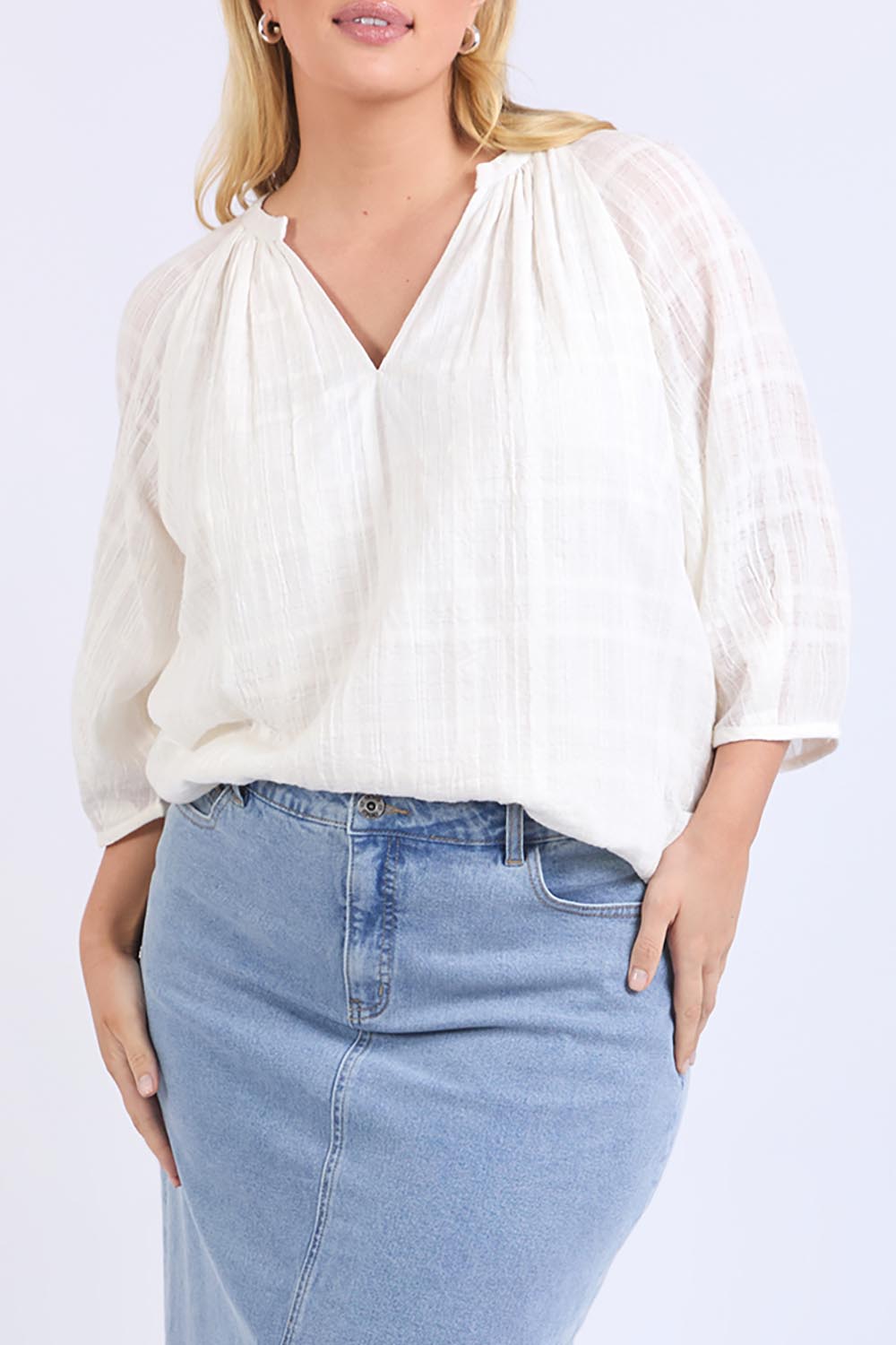 A model wearing the Isabella Cotton Blend Blouse in colour Marshmello, from the front, cropped image