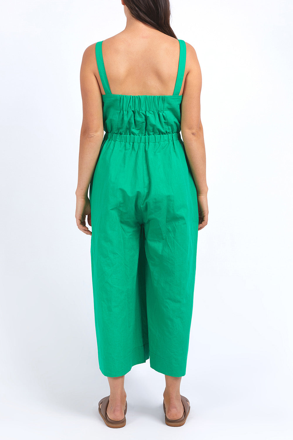 A model wearing the Stevie Jumpsuit in colour Greenbriar (Green), from the back