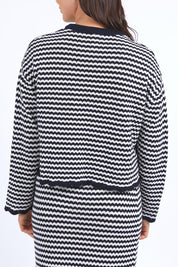 A model wearing the Rosie Stripe Cotton Knit Top in colour Navywhite, from the back