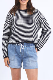 A model wearing the Rosie Stripe Cotton Knit Top in colour Navywhite, from the front, cropped image