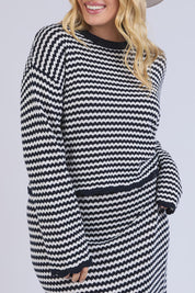 A model wearing the Rosie Stripe Cotton Knit Top in colour Navywhite, from the front, cropped image