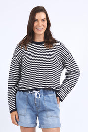 A model wearing the Rosie Stripe Cotton Knit Top in colour Navywhite, from the front, cropped image