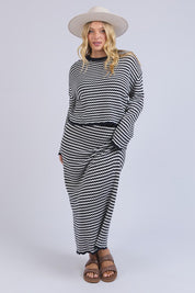 A model wearing the Rosie Stripe Cotton Knit Top in colour Navywhite, from the front, showing the whole outfit