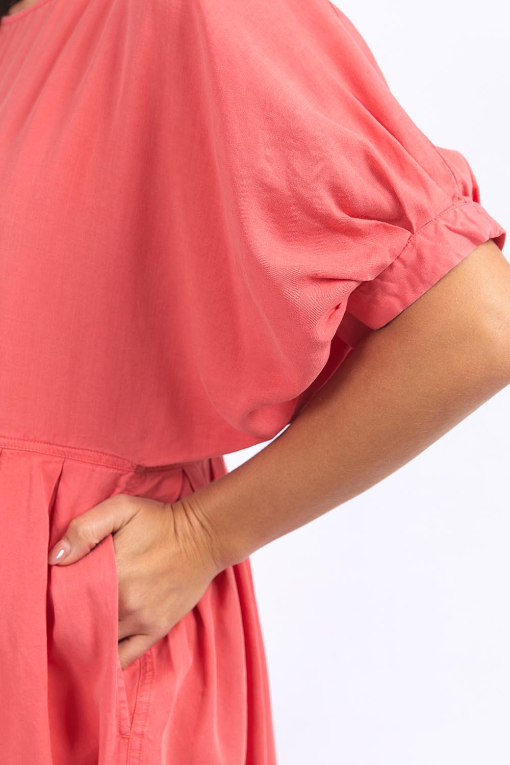 A model wearing the Bliss Relaxed Lyocell Linen Dress in colour Watermelon (Pink), from the front, cropped image