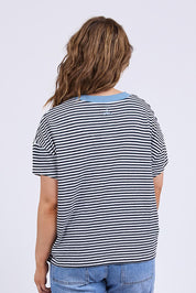 A model wearing the Liv Cotton Linen Vee Tee in colour Navywhite (Blue), from the back