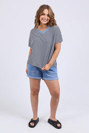 A model wearing the Liv Cotton Linen Vee Tee in colour Navywhite (Blue), from the front, showing the whole outfit
