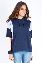 Model Ilona wearing size 10 of the Amelia Panel Hoody in colour Navycontr (Blue), from the front, cropped image