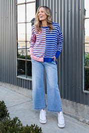 A model wearing the Louise Spliced Cotton Knit in colour Deepbluepn, from the front, showing the whole outfit