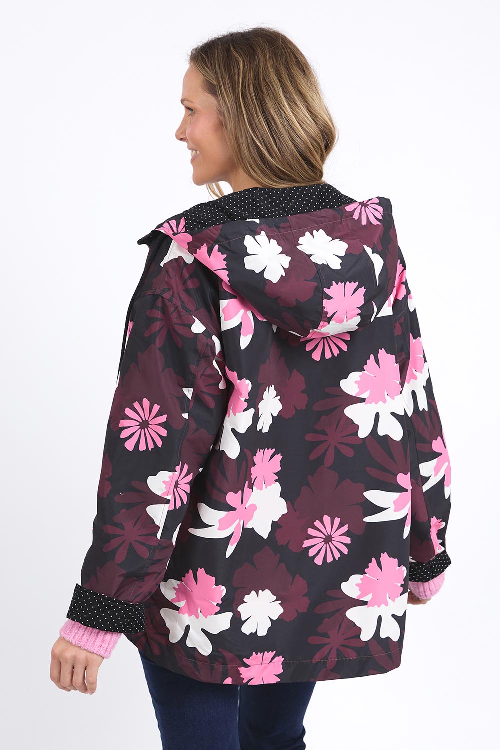 A model wearing the Hadley Floral Raincoat in colour Hadleyprin, from the back
