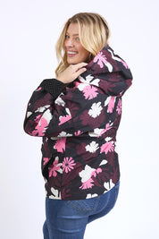 A model wearing the Hadley Floral Raincoat in colour Hadleyprin, from the back