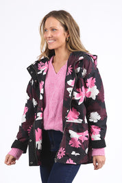 A model wearing the Hadley Floral Raincoat in colour Hadleyprin, from the front, cropped image