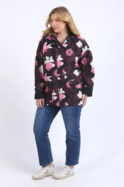 A model wearing the Hadley Floral Raincoat in colour Hadleyprin, from the front, showing the whole outfit