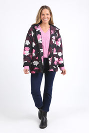 A model wearing the Hadley Floral Raincoat in colour Hadleyprin, from the front, showing the whole outfit