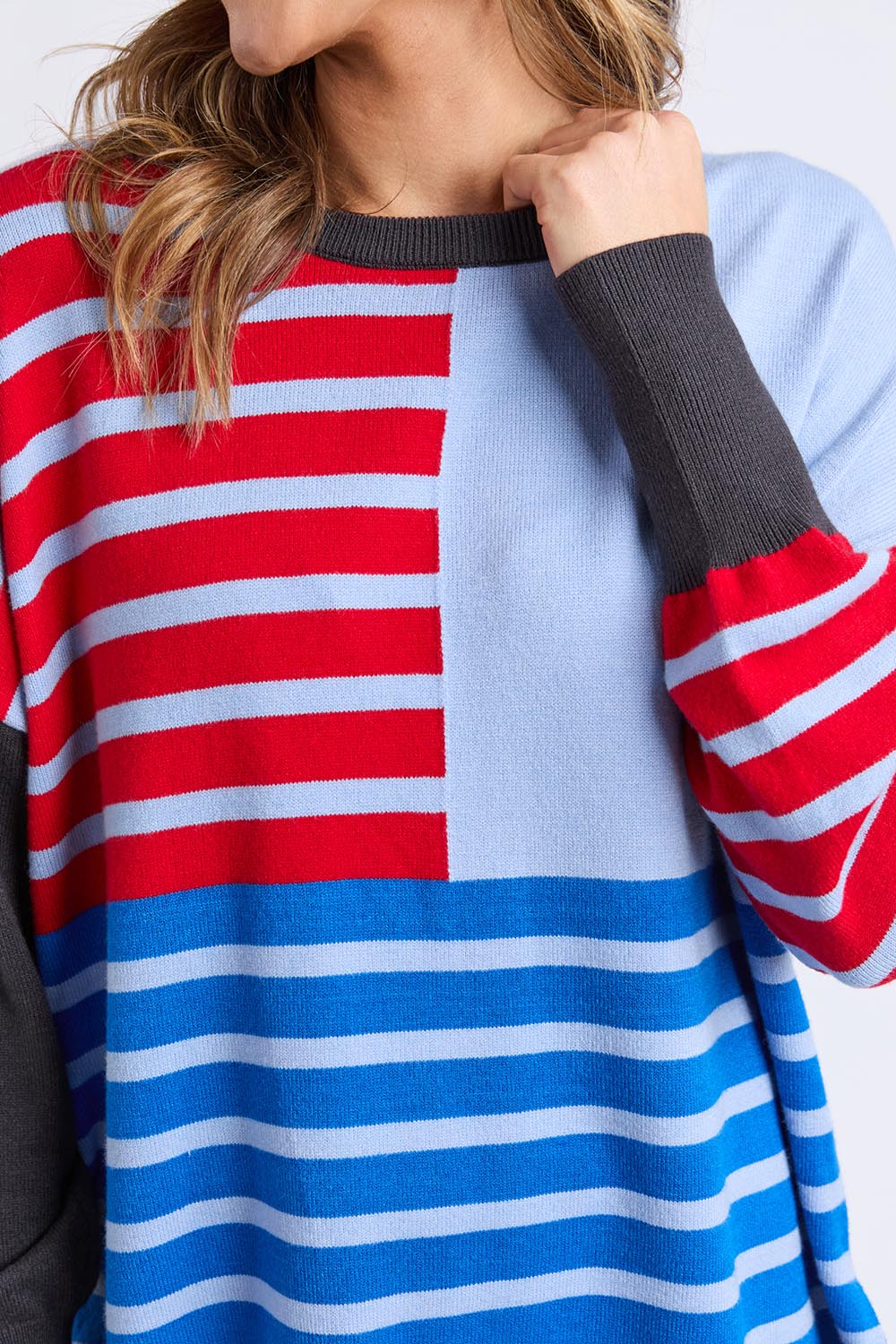 A model wearing the Effie Mixed Knit in colour Cranchar, from the front, cropped image
