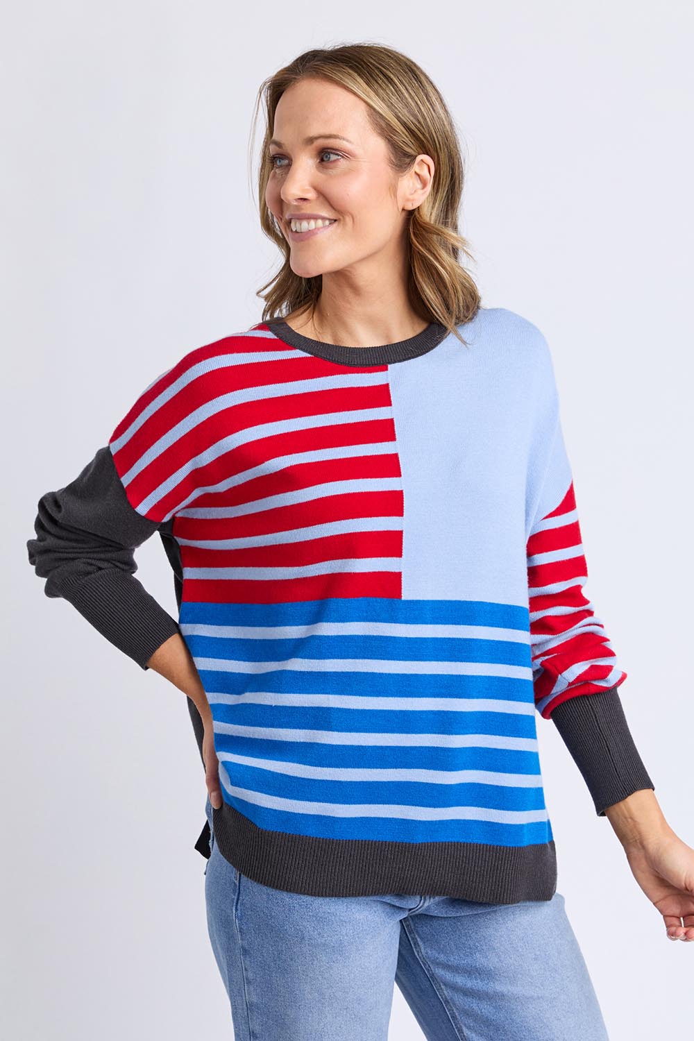 A model wearing the Effie Mixed Knit in colour Cranchar, from the front, cropped image