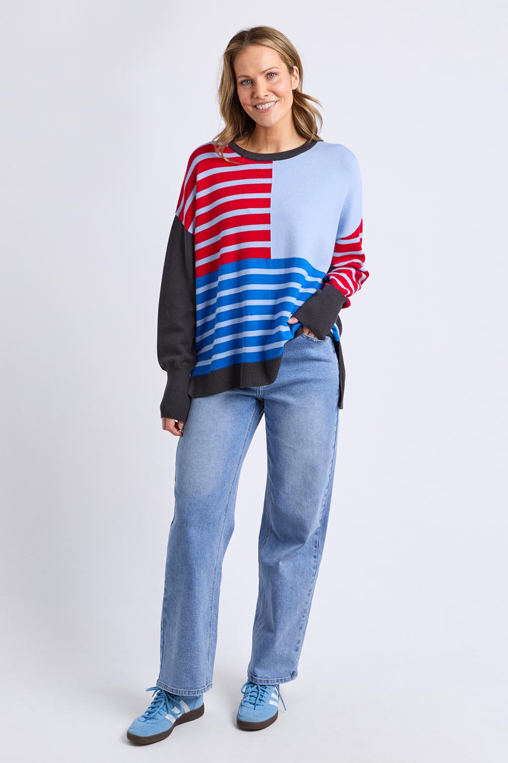 A model wearing the Effie Mixed Knit in colour Cranchar, from the front, showing the whole outfit