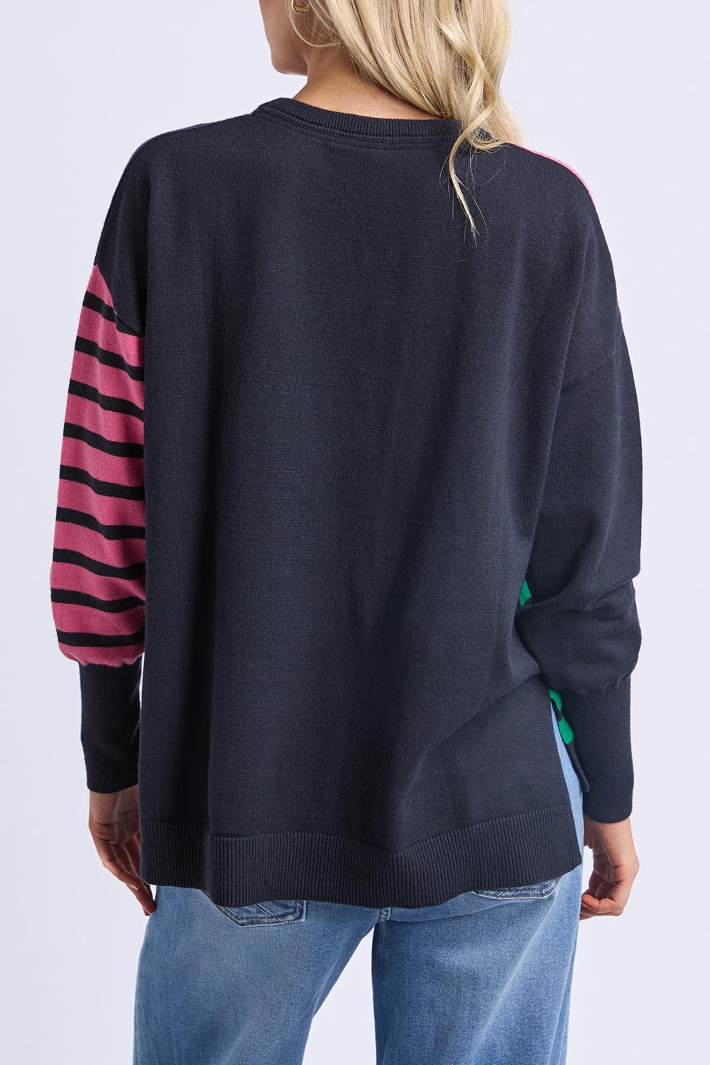 A model wearing the Effie Mixed Knit in colour Pinkturq, from the back