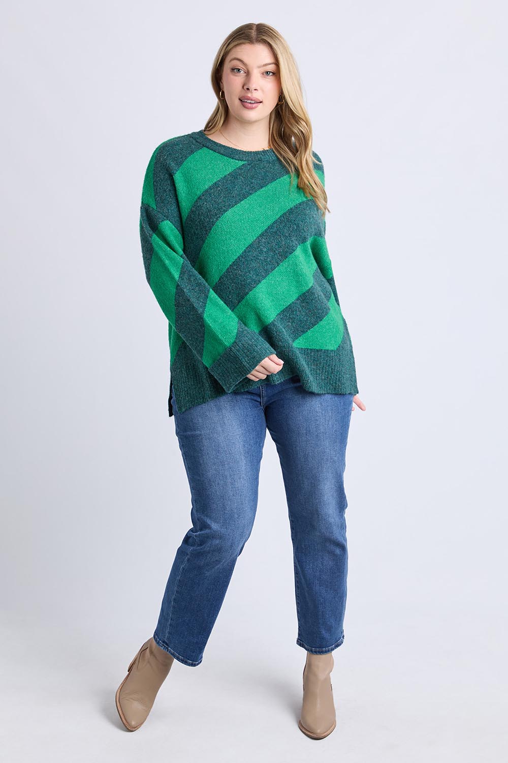 A model wearing the Sage Diagonal Stripe Knit in colour Turquoise (Green), from the front, showing the whole outfit