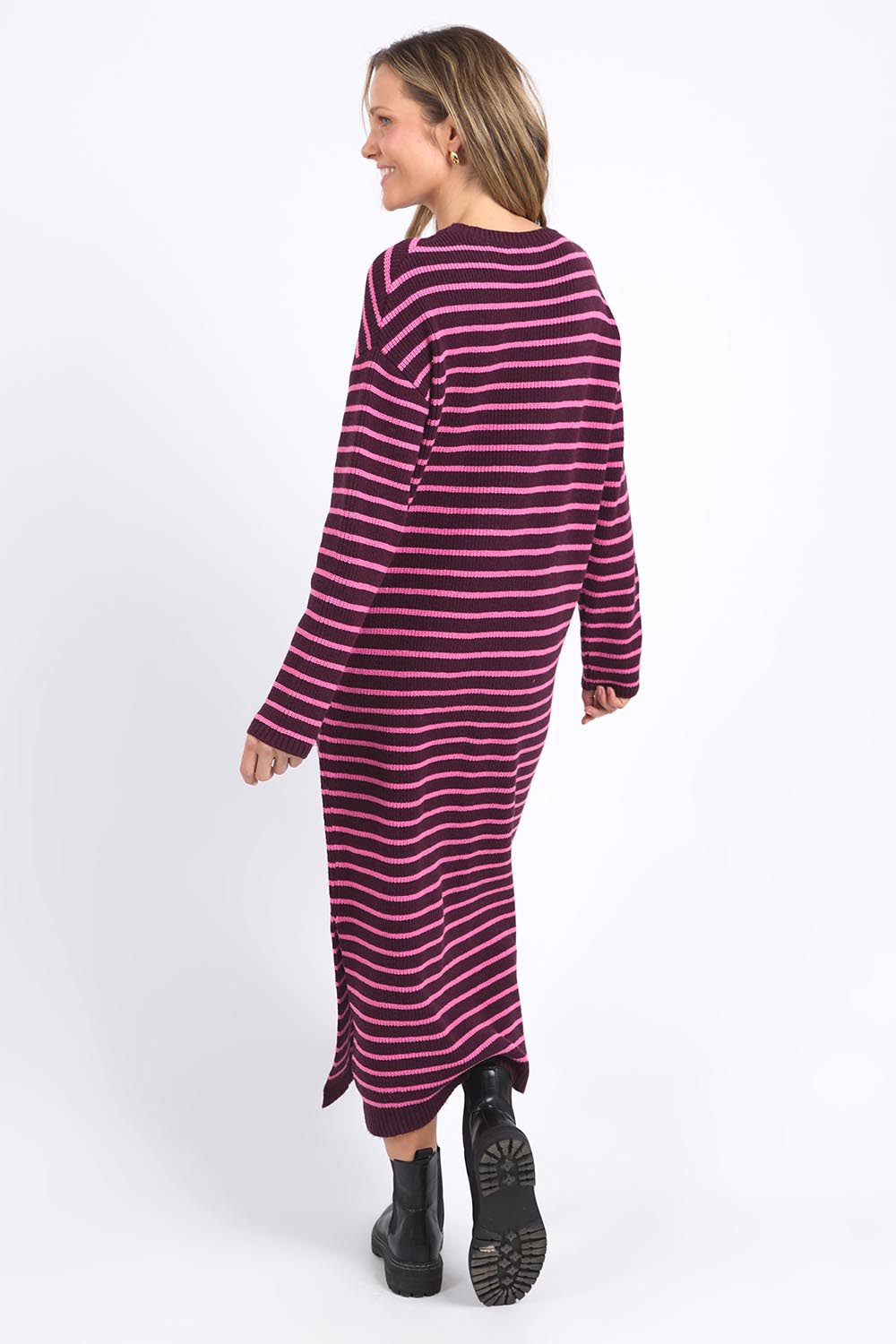 A model wearing the Tess Stripe Cashmere Blend Knit Dress in colour Merlotpink, from the back