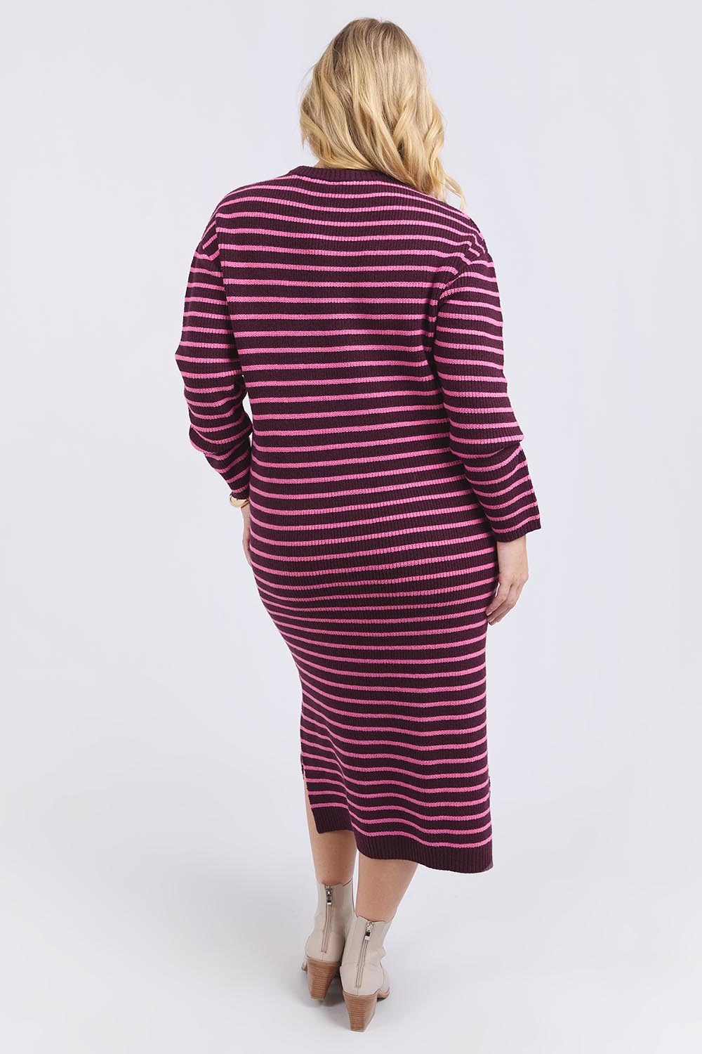 A model wearing the Tess Stripe Cashmere Blend Knit Dress in colour Merlotpink, from the back