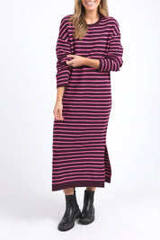 A model wearing the Tess Stripe Cashmere Blend Knit Dress in colour Merlotpink, from the front, cropped image