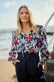 Model Maggie wearing size 10 of the Indie Floral Lyocell Linen Blouse in colour Indieprint, from the front, showing the whole outfit