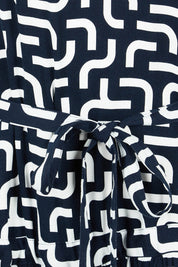 Product shot of the Gemma Geo Dress in colour Navygeo (Blue), detail