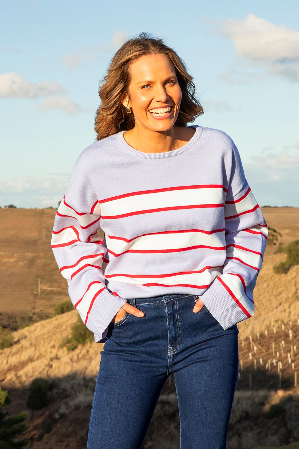 A model wearing the Joni Stripe Cashmere Blend Knit in colour Lilacpoppy, from the front, showing the whole outfit