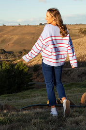 A model wearing the Joni Stripe Cashmere Blend Knit in colour Lilacpoppy, from the front, showing the whole outfit