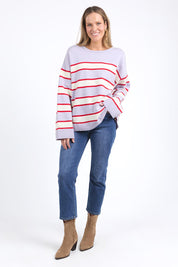 A model wearing the Joni Stripe Cashmere Blend Knit in colour Lilacpoppy, from the front, showing the whole outfit