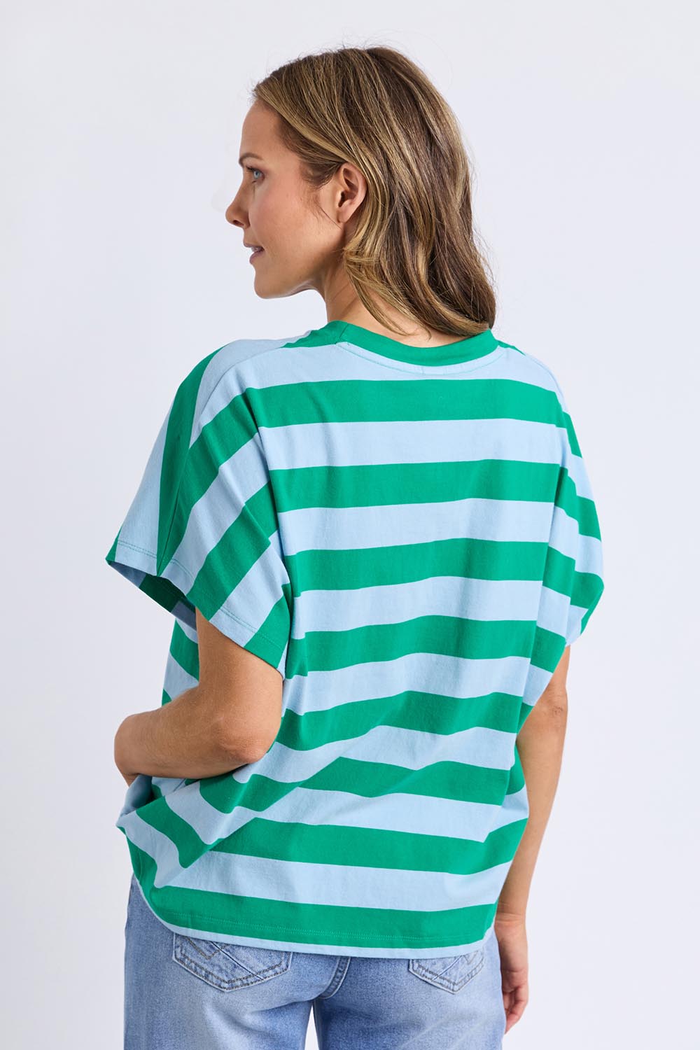 A model wearing the Poet Cotton Tee in colour Greenblue, from the back