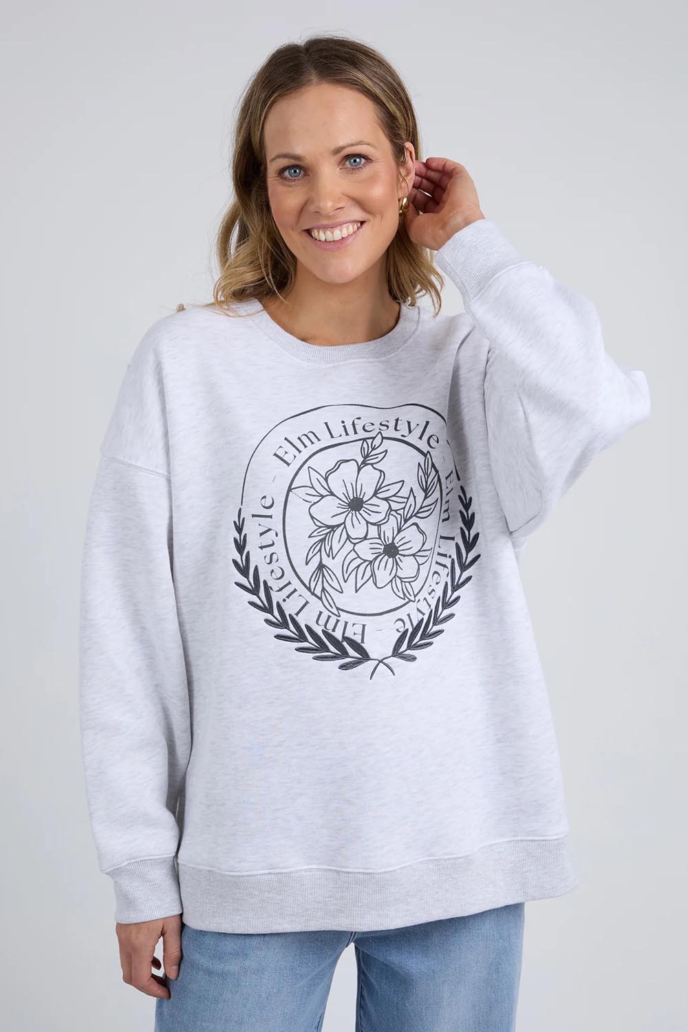 A model wearing the Emblem Cotton Crew in colour Greymarle (Grey), from the front, cropped image