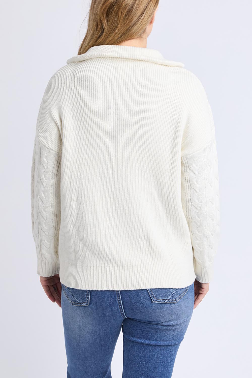 A model wearing the Zalie Zip Cotton Knit in colour Marshmello, from the back