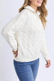 A model wearing the Zalie Zip Cotton Knit in colour Marshmello, from the front, cropped image