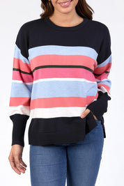 A model wearing the Lacey Stripe Knit in colour Navypink, from the front, cropped image