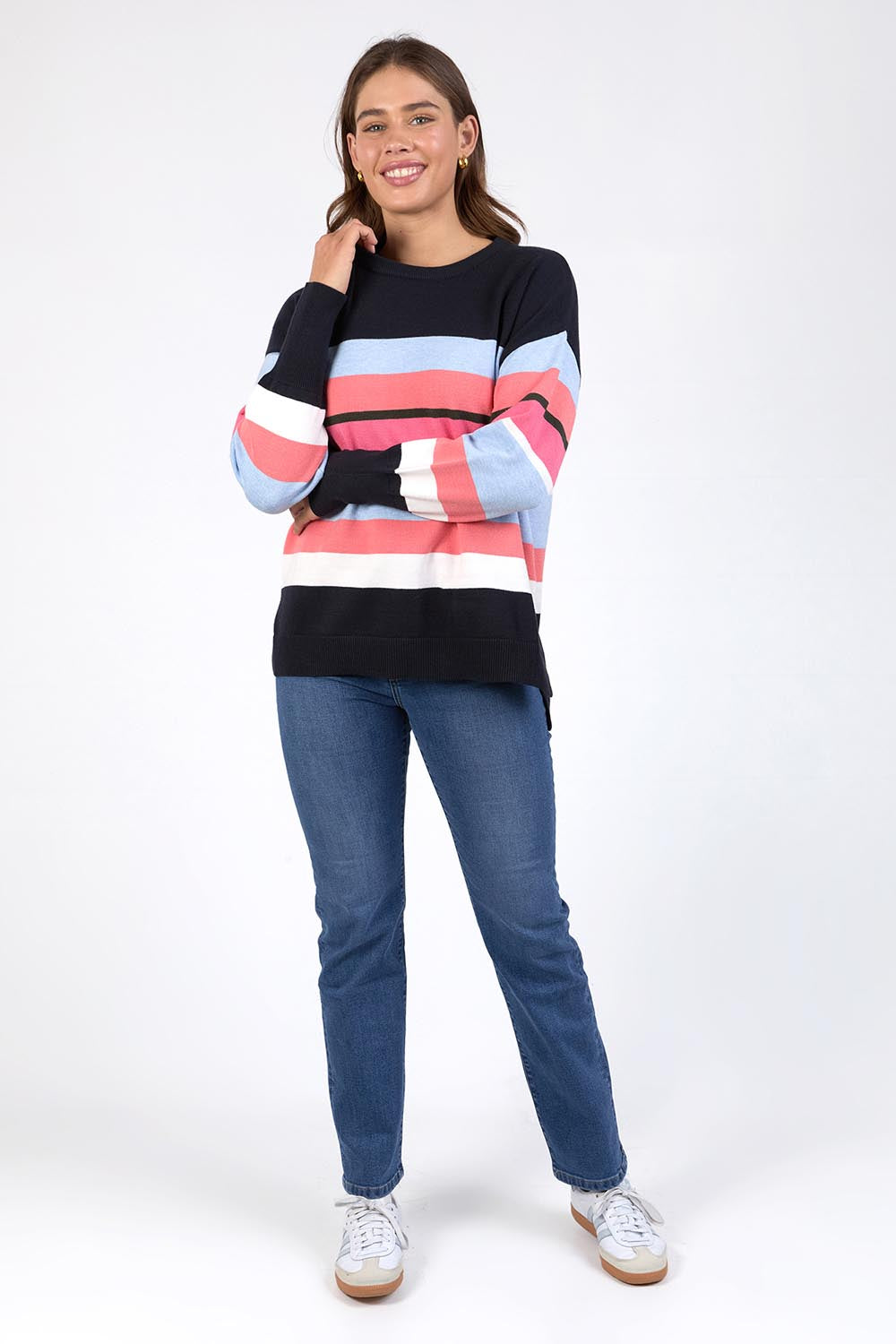 A model wearing the Lacey Stripe Knit in colour Navypink, from the front, showing the whole outfit