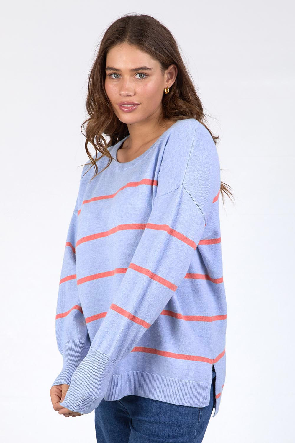 A model wearing the Charli Stripe Knit in colour Skyblue, from the front, cropped image