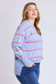 A model wearing the Charli Stripe Knit in colour Skyblue, from the front, cropped image