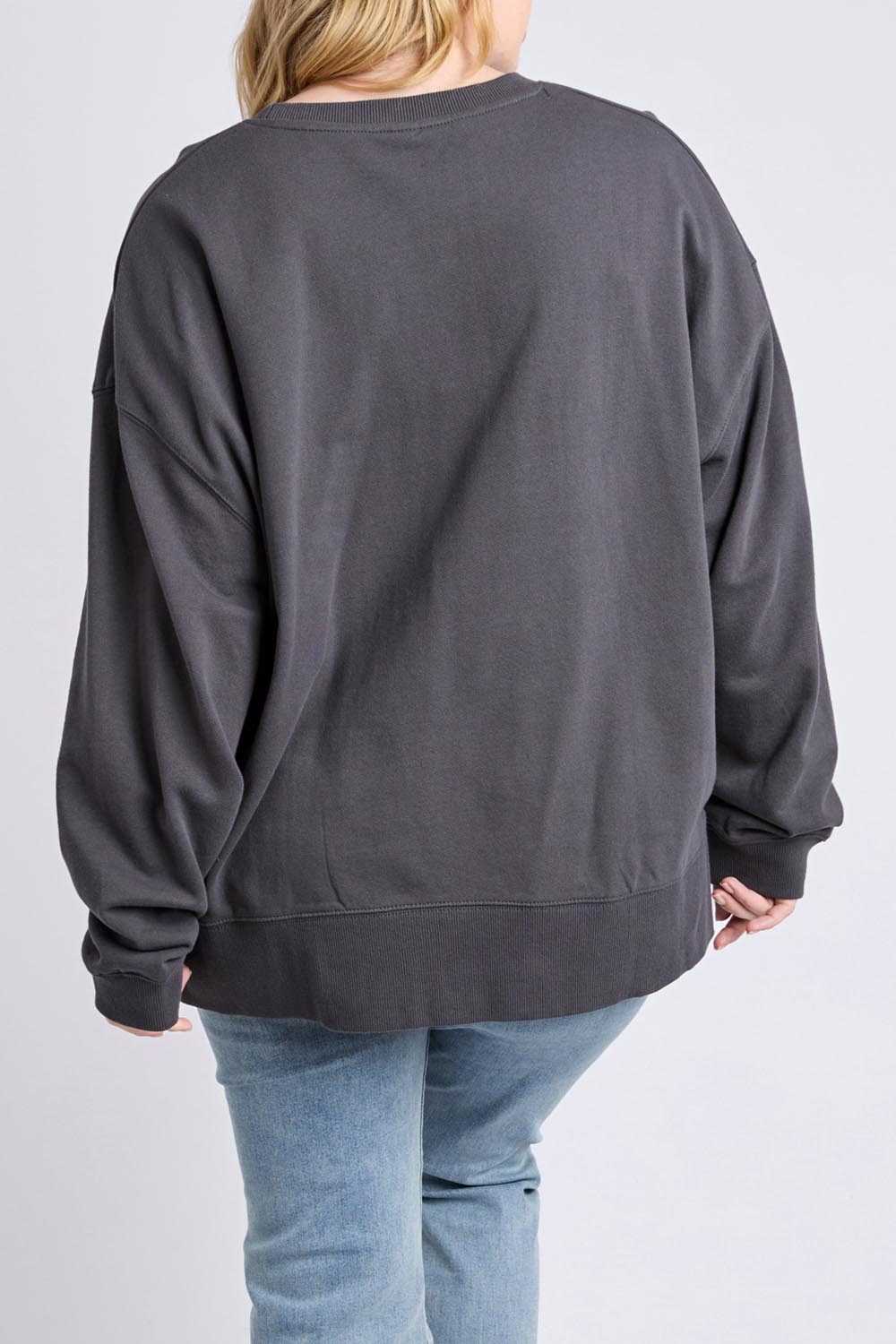 A model wearing the Tulip Cotton Crew in colour Washblack (Black), from the back