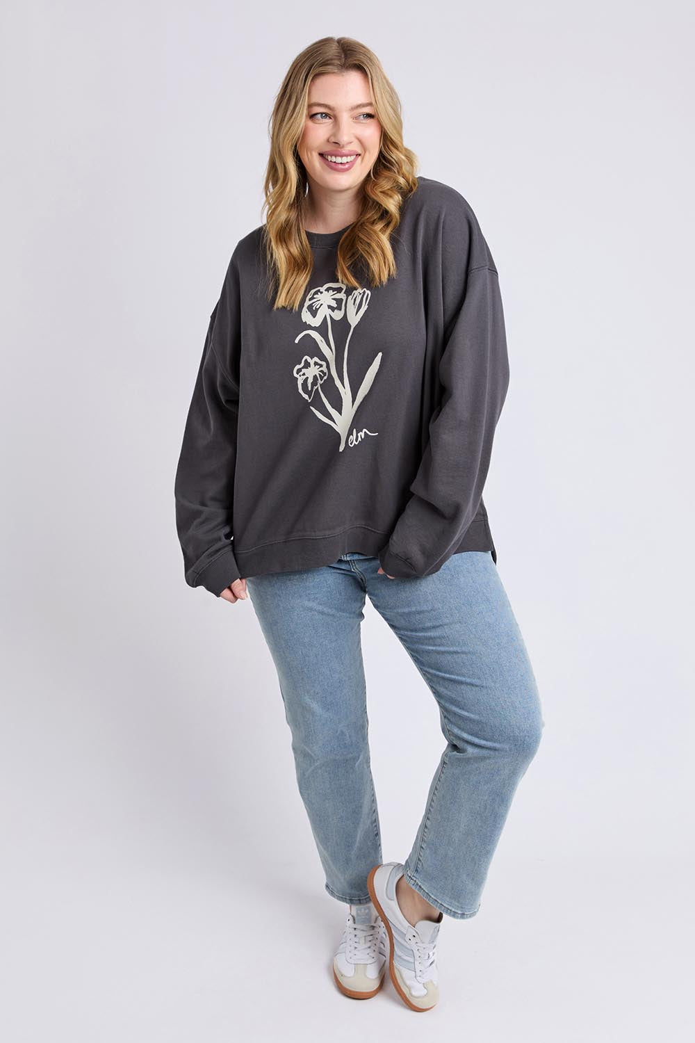 A model wearing the Tulip Cotton Crew in colour Washblack (Black), from the front, showing the whole outfit