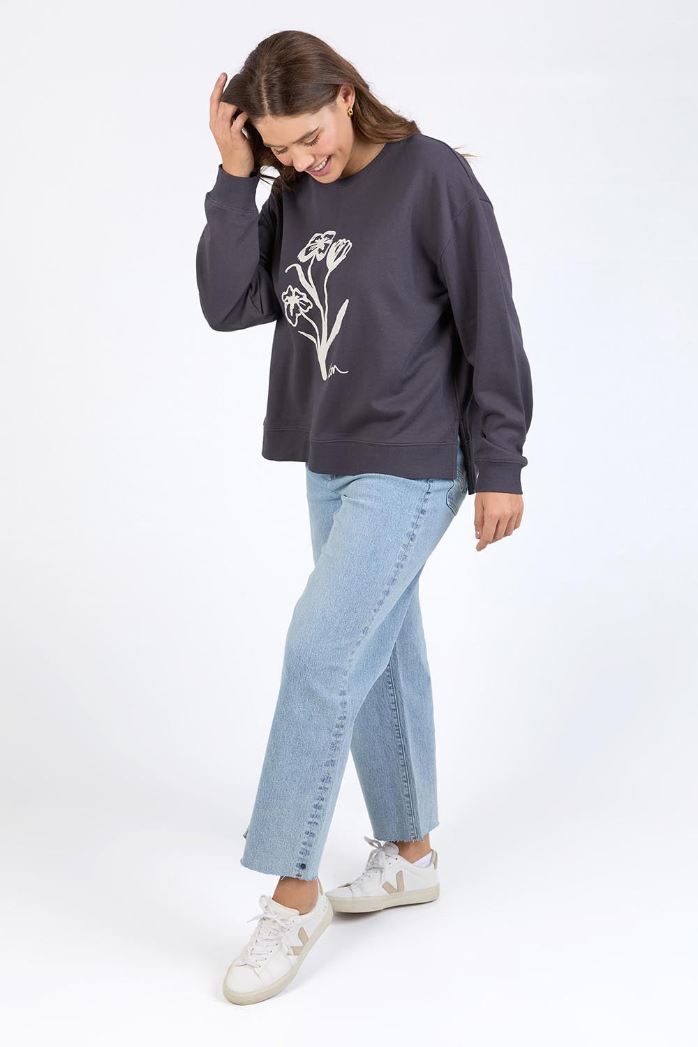 A model wearing the Tulip Cotton Crew in colour Washblack (Black), from the front, showing the whole outfit