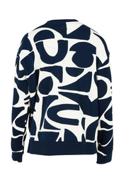 Product shot of the Mural Cotton Crew in colour Navy, from the back