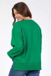 A model wearing the Madeleine Stamer II Cotton Crew in colour Pinegreen (Green), from the back