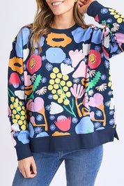 A model wearing the Flower Medley Cotton Crew in colour Multiflora, from the front, cropped image