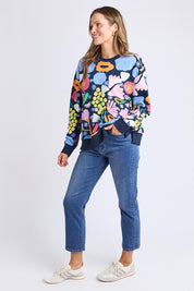 A model wearing the Flower Medley Cotton Crew in colour Multiflora, from the front, showing the whole outfit